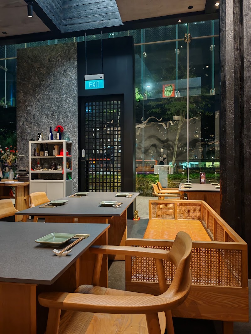Chef Toshiyuki preparing sushi at counter with precision