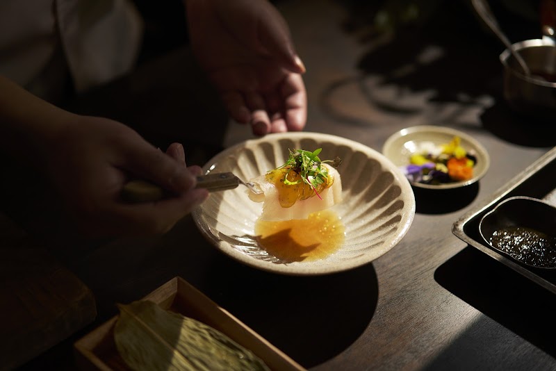 Black and white colonial house exterior Iru Den