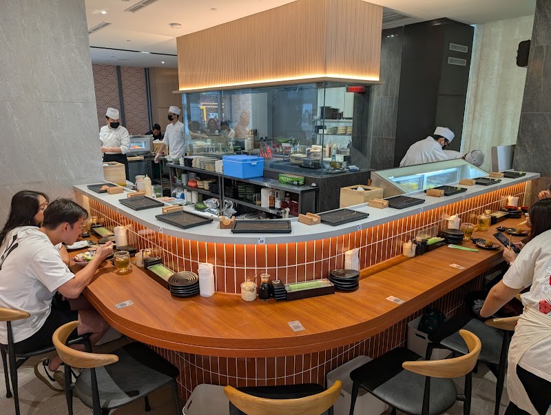 Sushi Zushi counter with chef preparing nigiri