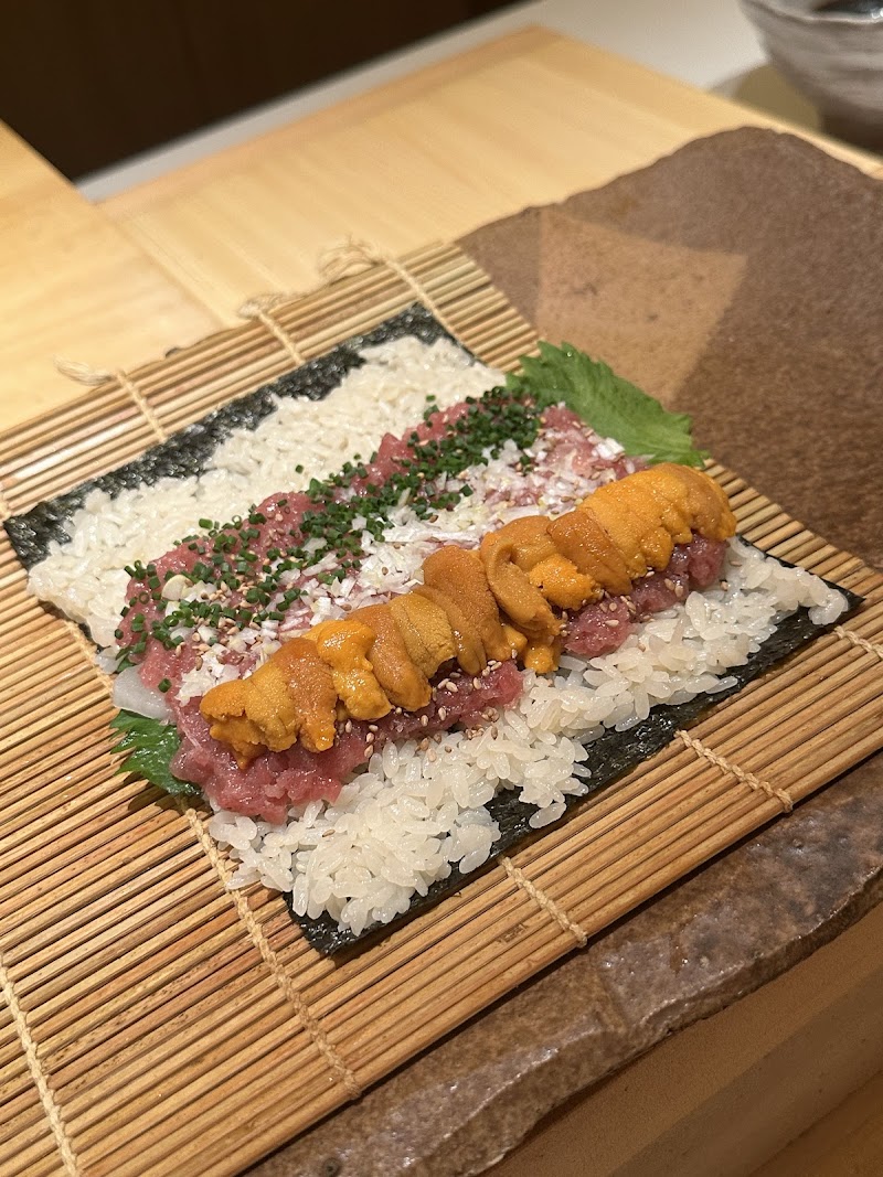 Chef Rinto Sasagawa preparing sushi at Takahashi